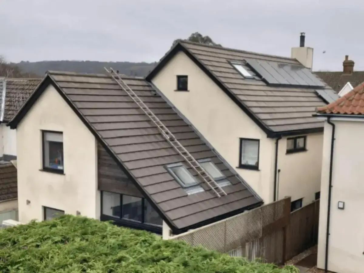 Fully renovated pitched roof featuring modern concrete tiles, roof windows, and a roof ladder system. Installed by Norfolk Exterior Solutions